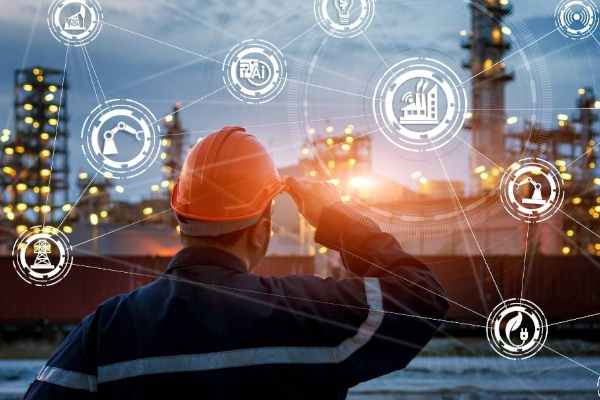 Future of Pulp and Paper Industry Man looking at a pulp and paper mill with data analytics in view