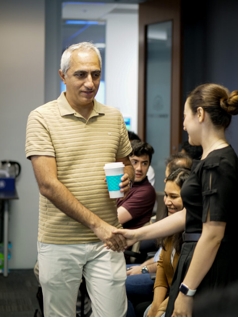 ProcessMiner team members greeting each other in the office